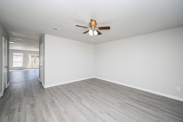 6514 Kentwick Dr, Houston, TX 77084 - spare room featuring visible vents, baseboards, a ceiling fan, and wood finished floors