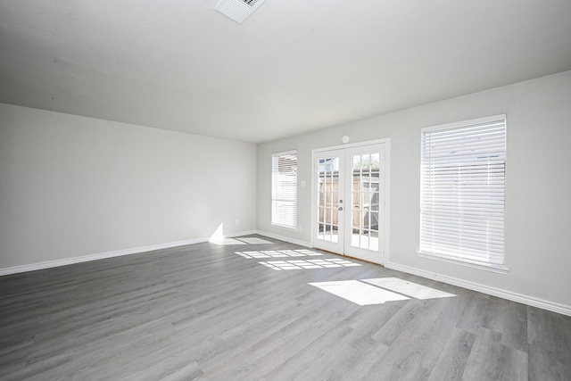 6514 Kentwick Dr, Houston, TX 77084 - interior space featuring visible vents, french doors, baseboards, and wood finished floors
