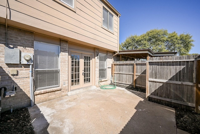 6514 Kentwick Dr, Houston, TX 77084 - view of patio with french doors and fence