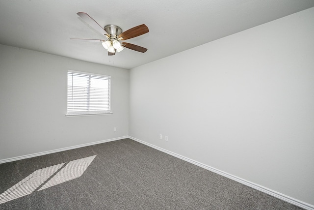 6514 Kentwick Dr, Houston, TX 77084 - unfurnished room featuring dark colored carpet, a ceiling fan, and baseboards