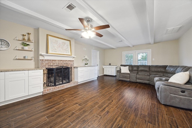 101 Royal Ct, Friendswood, TX 77546 - living room featuring ceiling fan, a brick fireplace, dark wood-style floors, and beamed ceiling