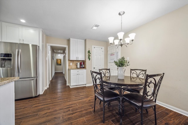 101 Royal Ct, Friendswood, TX 77546 - dining space with baseboards, a chandelier, dark wood-style floors, and recessed lighting