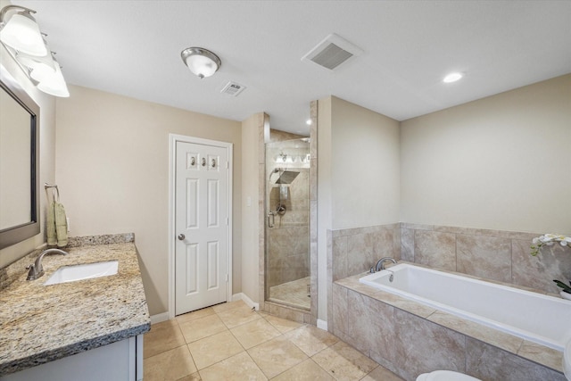 101 Royal Ct, Friendswood, TX 77546 - bathroom with a garden tub, tile patterned floors, a stall shower, vanity, and recessed lighting