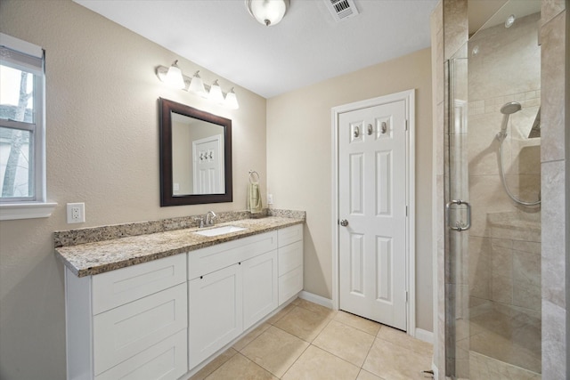 101 Royal Ct, Friendswood, TX 77546 - bathroom featuring a shower stall, vanity, tile patterned flooring, and baseboards