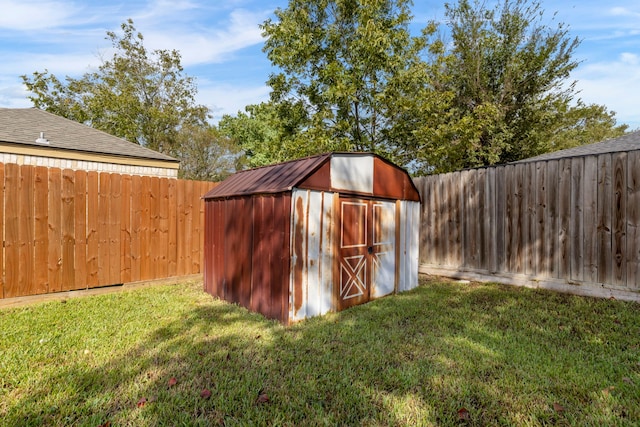 view of shed with a fenced backyard