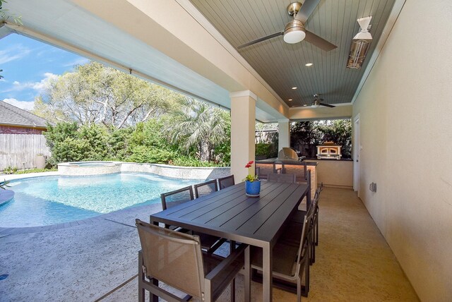 view of swimming pool with outdoor dining area, a patio, a ceiling fan, and fence