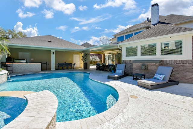 pool featuring outdoor dry bar and a patio