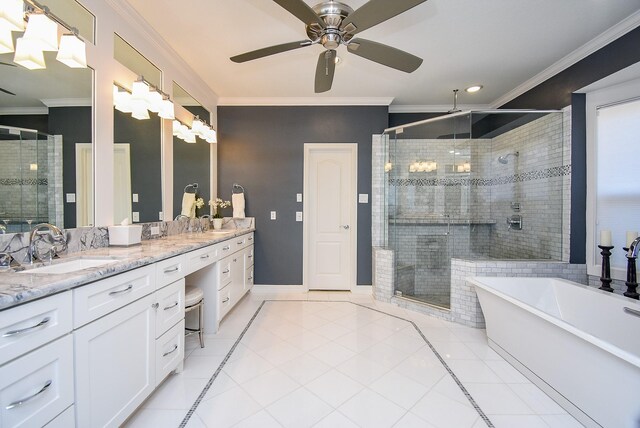 bathroom with tile patterned flooring, a shower stall, vanity, and crown molding
