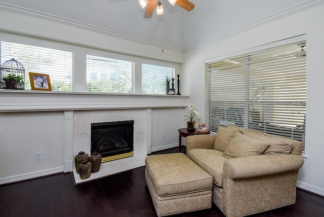 sitting room with baseboards, ceiling fan, dark wood finished floors, vaulted ceiling, and a tile fireplace