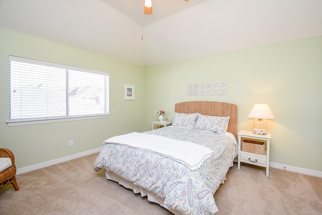 bedroom with baseboards, light carpet, lofted ceiling, and ceiling fan