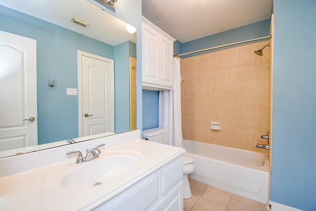 full bathroom featuring tile patterned flooring, visible vents, shower / tub combo, a textured ceiling, and vanity