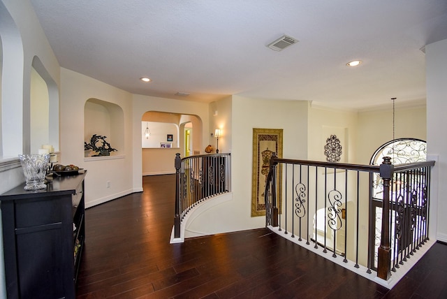hallway featuring visible vents, an upstairs landing, wood finished floors, recessed lighting, and baseboards