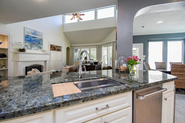 kitchen with a healthy amount of sunlight, open floor plan, and a sink