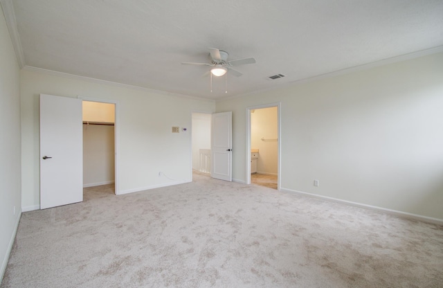 unfurnished bedroom with visible vents, carpet floors, baseboards, and ornamental molding