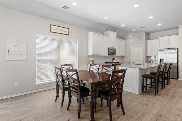 156 Buckeye Dr, Montgomery, TX 77316 - dining space featuring recessed lighting, light wood-type flooring, and visible vents