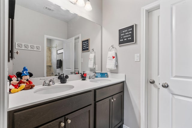 156 Buckeye Dr, Montgomery, TX 77316 - bathroom with a sink, a shower, double vanity, and visible vents