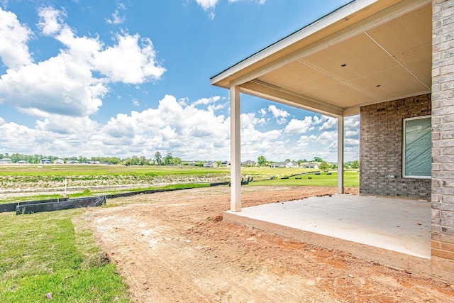 197 Peninsula Point Dr, Montgomery, TX 77356 - view of yard with a patio area and a rural view