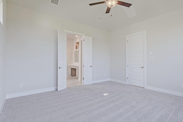 197 Peninsula Point Dr, Montgomery, TX 77356 - unfurnished bedroom featuring light colored carpet, ensuite bathroom, and a ceiling fan