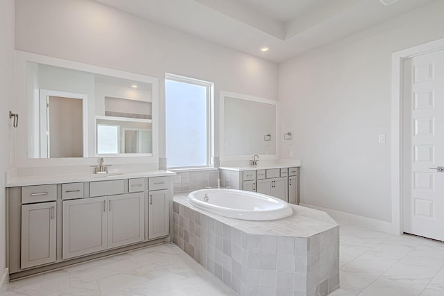 197 Peninsula Point Dr, Montgomery, TX 77356 - full bathroom featuring marble finish floors, two vanities, a bath, and recessed lighting