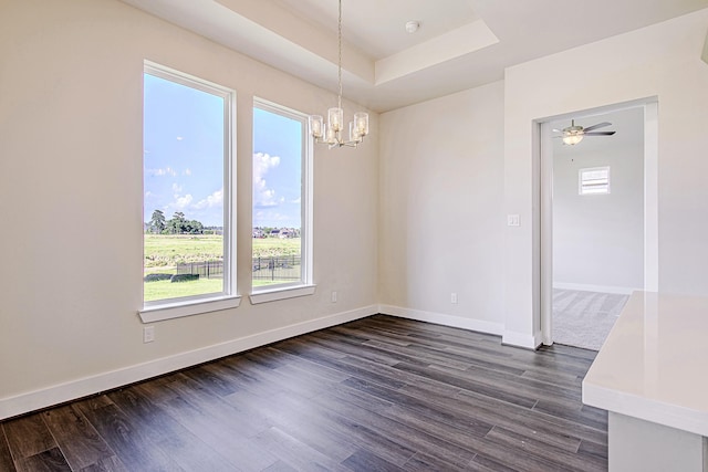 197 Peninsula Point Dr, Montgomery, TX 77356 - unfurnished dining area featuring a chandelier, dark wood-style floors, and a raised ceiling