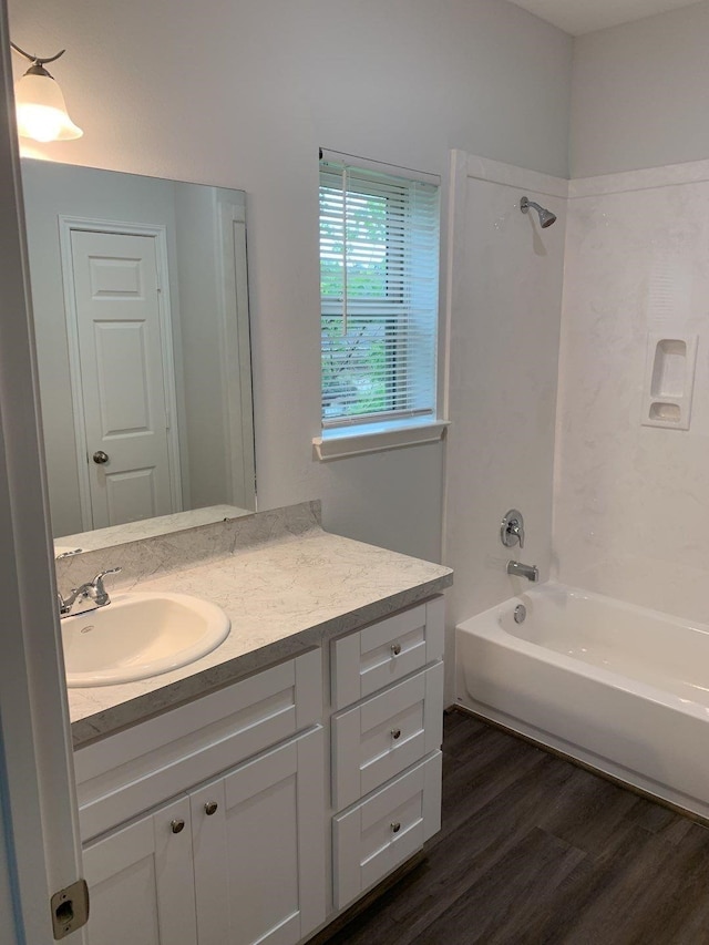8149 Homewood Ln, Houston, TX 77028 - bathroom featuring vanity, shower / tub combination, and wood finished floors