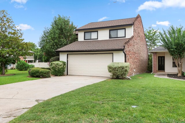 view of front facade with an attached garage, concrete driveway, roof with shingles, and a front yard