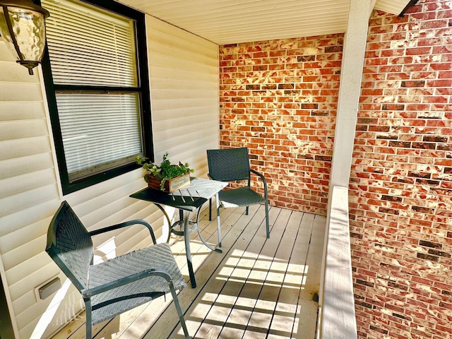 wooden terrace with a porch