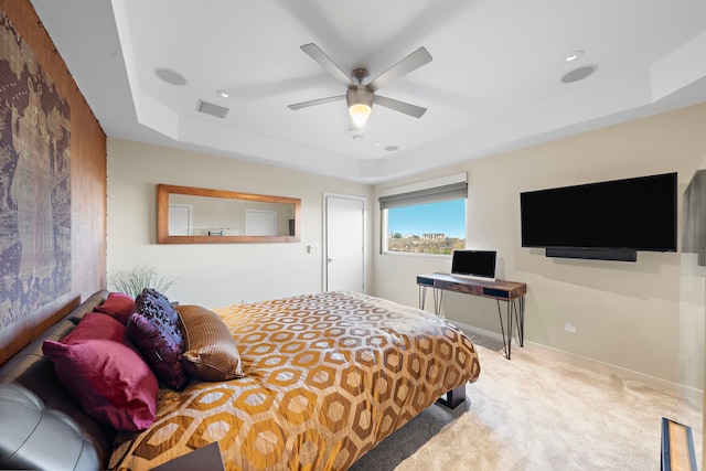 102 Quitman St Unit 405, Houston, TX 77009 - carpeted bedroom with visible vents, baseboards, ceiling fan, recessed lighting, and a tray ceiling