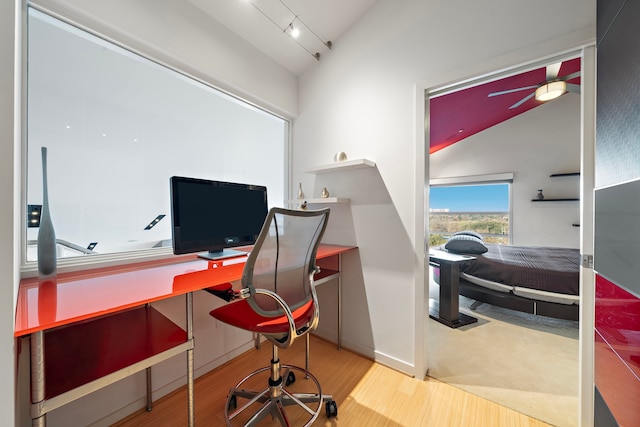 102 Quitman St Unit 405, Houston, TX 77009 - office space featuring rail lighting, vaulted ceiling, and wood finished floors