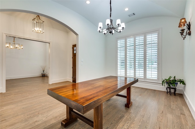 3302 Elmridge St, Houston, TX 77025 - dining room with visible vents, baseboards, light wood-type flooring, an inviting chandelier, and arched walkways