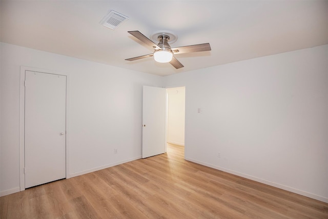 unfurnished bedroom featuring baseboards, visible vents, and light wood-type flooring