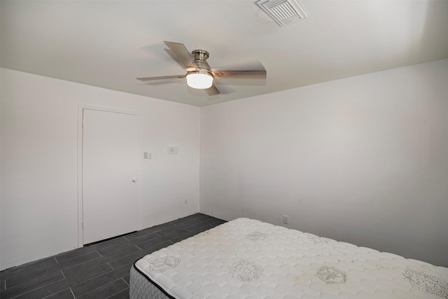bedroom with ceiling fan and visible vents