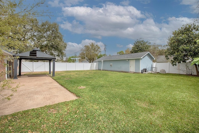 view of yard featuring a fenced backyard, an outdoor structure, a gazebo, and a patio area