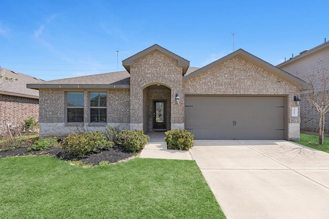 3917 Everett Terrace Ln, Missouri City, TX 77459 - single story home featuring a front yard, an attached garage, brick siding, and driveway