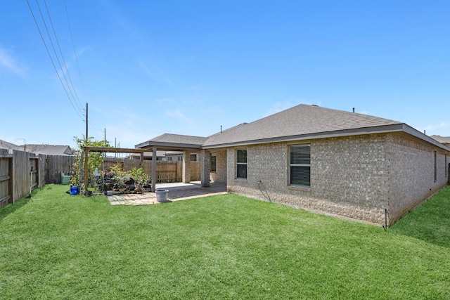 3917 Everett Terrace Ln, Missouri City, TX 77459 - rear view of house with a patio, a yard, a fenced backyard, and brick siding