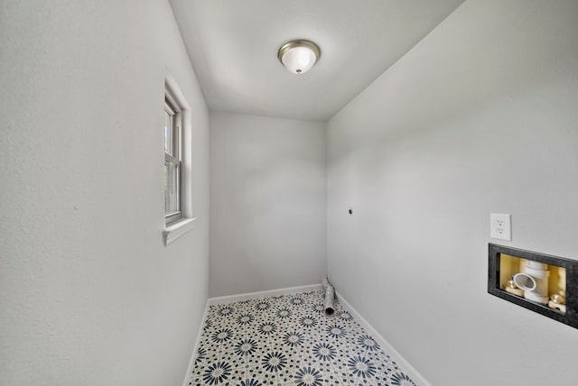 washroom featuring hookup for an electric dryer, baseboards, tile patterned floors, laundry area, and hookup for a washing machine