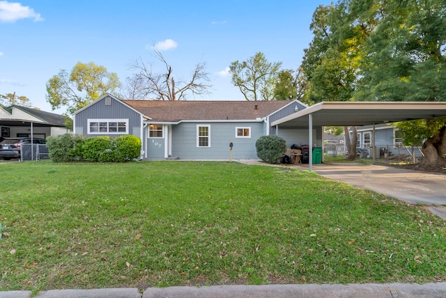 ranch-style house featuring a carport, concrete driveway, and a front lawn