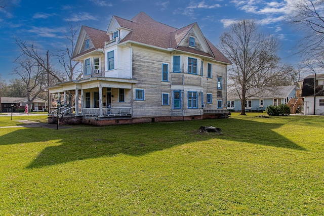 406 7th St, Sealy, TX 77474 - view of property exterior with a lawn, a porch, and a shingled roof