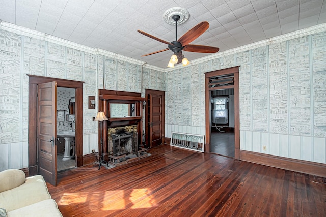 406 7th St, Sealy, TX 77474 - living room featuring wallpapered walls, hardwood / wood-style floors, baseboards, and ceiling fan