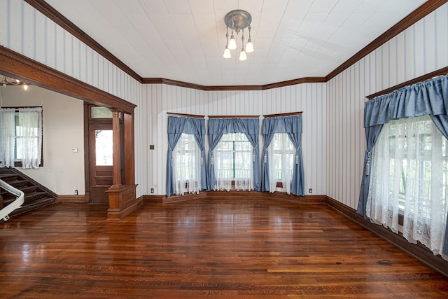 406 7th St, Sealy, TX 77474 - interior space featuring wood finished floors, crown molding, and a notable chandelier