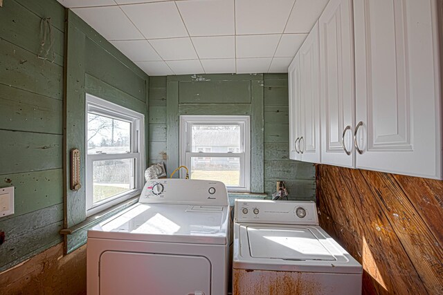 406 7th St, Sealy, TX 77474 - laundry area featuring cabinet space, a wealth of natural light, and washer and dryer