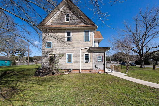 406 7th St, Sealy, TX 77474 - rear view of property featuring crawl space and a yard