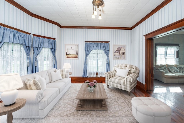 406 7th St, Sealy, TX 77474 - living room featuring crown molding, healthy amount of natural light, hardwood / wood-style floors, and baseboards