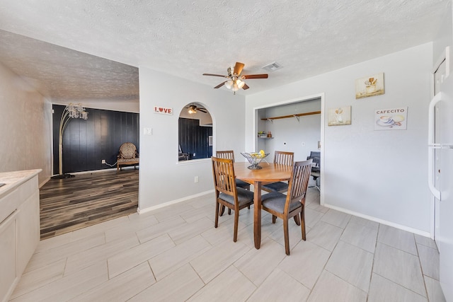 14106 Meyersville Dr, Houston, TX 77049 - dining area with a ceiling fan, baseboards, and a textured ceiling