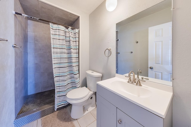 14106 Meyersville Dr, Houston, TX 77049 - bathroom with toilet, vanity, tile patterned flooring, a tile shower, and a textured wall
