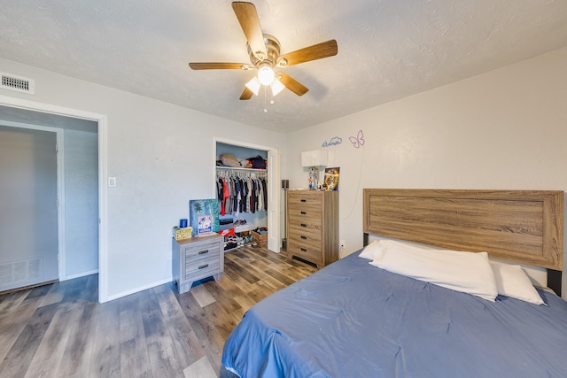 14106 Meyersville Dr, Houston, TX 77049 - bedroom with wood finished floors, baseboards, a closet, and ceiling fan