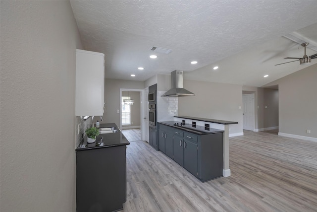 9315 Fairdale Ln, Houston, TX 77063 - kitchen featuring wall chimney exhaust hood, stainless steel oven, a sink, dark countertops, and baseboards