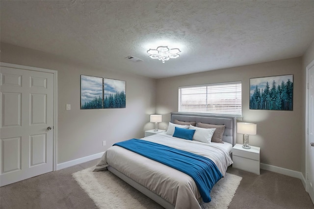 9315 Fairdale Ln, Houston, TX 77063 - carpeted bedroom with baseboards and a textured ceiling
