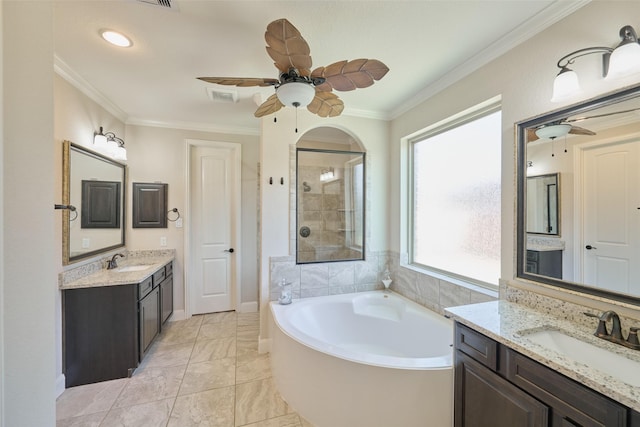 120 Shane St, Montgomery, TX 77316 - bathroom featuring a ceiling fan, ornamental molding, a bath, a tile shower, and two vanities