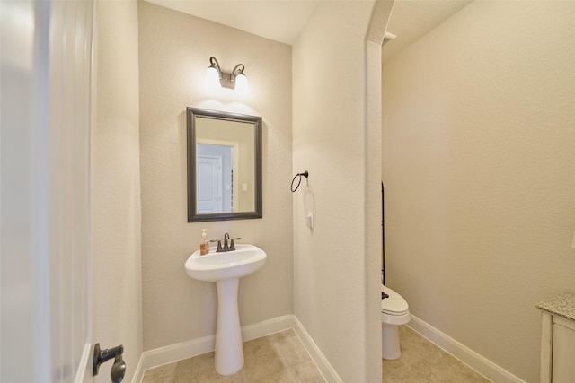 120 Shane St, Montgomery, TX 77316 - bathroom featuring tile patterned flooring, toilet, and baseboards